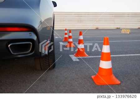 Rear Side of Car Approaching Cones on Driving Examination Course 133976620
