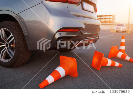 Knocked Over Traffic Cones Behind Learner Driver Vehicle Knocked Over Traffic Cones Behind Learner Driver Vehicle 133976629