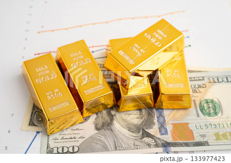 Gold bars on US dollar banknote money, finance trading investment business currency concept. 133977423