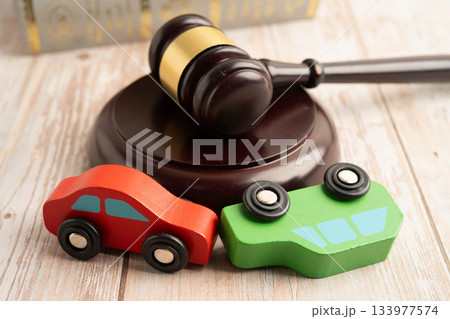Car accident lawsuit and insurance, Judge hammer with car model. Car accident lawsuit and insurance, Judge hammer with car model. 133977574