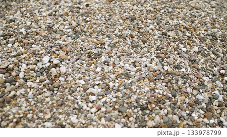 Small natural gravel pebbles creating textured surface Small natural gravel pebbles creating textured surface 133978799