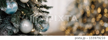 Banner christmas tree with silver and blue ornaments and fairy lights with copy space 133979210