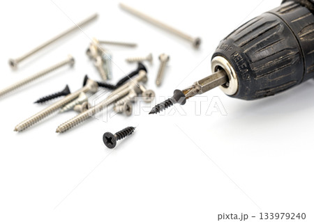 Power Drill with Screws on White Background for DIY Home Projects Power Drill with Screws on White Background for DIY Home Projects 133979240