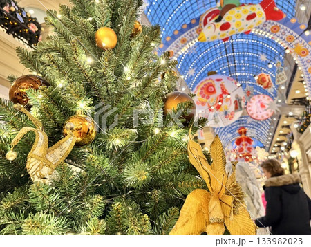 Bright Christmas Tree toys are hanging on the tree. New Year Bright Christmas Tree toys are hanging on the tree. New Year 133982023