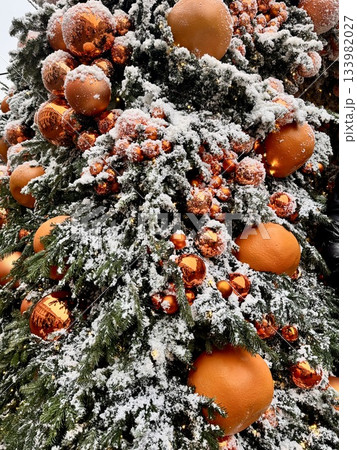 Bright Christmas Tree toys are hanging on the tree. New Year 133982027