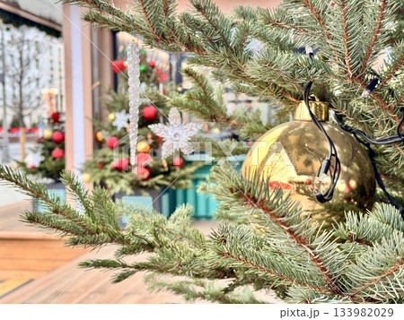 Bright Christmas Tree toys are hanging on the tree. New Year 133982029