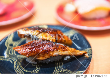 Unagi Eel sushi on black plate in Japanese restaurant 133982146