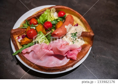 Dutch pancake with sausage, ham, fresh vegetable, tomato, cheese Dutch pancake with sausage, ham, fresh vegetable, tomato, cheese 133982176