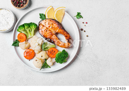 Healthy grilled fish salmon steak and vegetables Healthy grilled fish salmon steak and vegetables 133982489