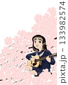 桜の花に桜の花に埋もれてギターを弾き語る女子高校生 133982574