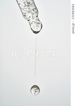 Cosmetic pipette dropping serum with air bubbles Cosmetic pipette dropping serum with air bubbles 133983081