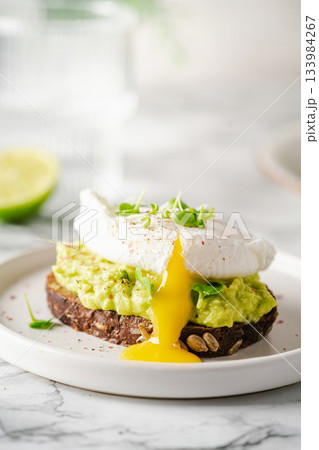 Avocado toast with poached egg Avocado toast with poached egg 133984267