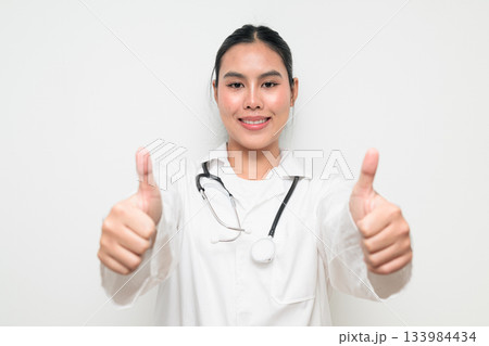 Happy Woman Doctor with Stethoscope in White Uniform on Plain Background Smiling 133984434