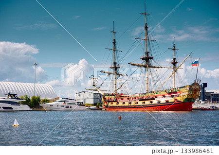 replica of a huge antique wooden frigate, thick ropes, reflections in the glossy sides of boats, huge masts replica of a huge antique wooden frigate, thick ropes, reflections in the glossy sides of boats, huge masts 133986481