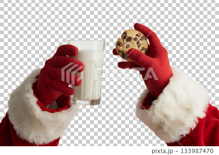 Santa's hands in red gloves holding glass of milk and christmas cookie, left out on christmas eve tradition 133987470