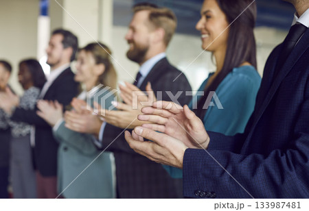 Close Up Of Business Team Applauding Hands, Celebrating Success At Office Close Up Of Business Team Applauding Hands, Celebrating Success At Office 133987481
