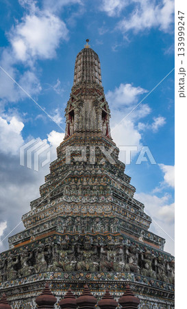 The Central Prang of Wat Arun (Temple of Dawn) in Bangkok, Thailand, against a Blue Sky The Central Prang of Wat Arun (Temple of Dawn) in Bangkok, Thailand, against a Blue Sky 133999247