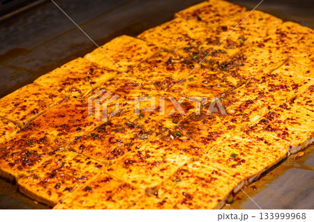 Delicious Sichuan-style grilled tofu during dinner service 133999968