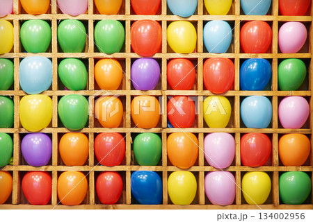 Balloon shooting gallery. Bright balls standing in a row Balloon shooting gallery. Bright balls standing in a row 134002956