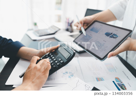 Business meeting, data analytics or women with graph presentation in office. Chart, analysis accounting team brainstorming economy, inflation or solution. business project finance investment concept. 134003356