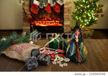 La Befana and Epiphany Italian Tradition with Fireplace, Candy and Holiday Decor 134004248