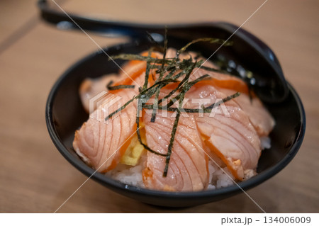 Grilled Salmon with rice, served in a bowl in the restaurant 134006009