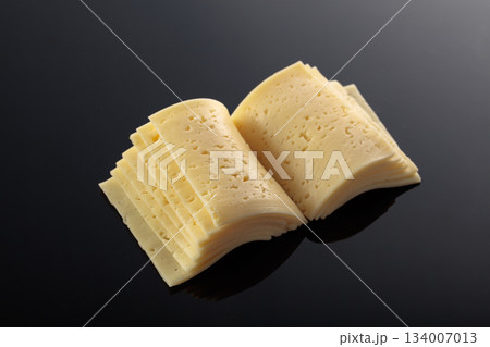 Cheese slices folded like an open book. Cheese slices folded like an open book. 134007013