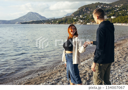 young caucasian couple tourists having fun on sea side, lifestyle people concept young caucasian couple tourists having fun on sea side, lifestyle people concept 134007067