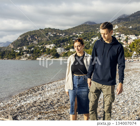 young caucasian couple tourists having fun on sea side, lifestyle people concept 134007074