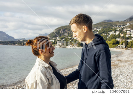 young caucasian couple tourists having fun on sea side, lifestyle people concept 134007091