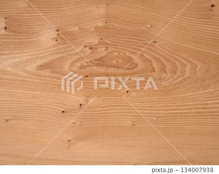 Warm Eibe veneer wood surface showcasing natural whorl patterns and knots Warm Eibe veneer wood surface showcasing natural whorl patterns and knots 134007938