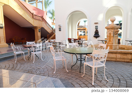 A cozy street cafe with beautiful white furniture A cozy street cafe with beautiful white furniture 134008069