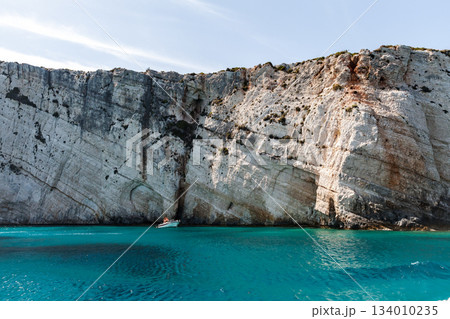 Rocky coast of Zakynthos island with natural stone arches Rocky coast of Zakynthos island with natural stone arches 134010235