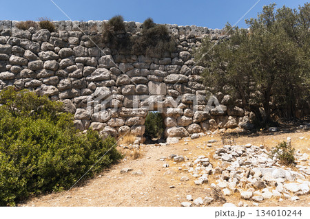 The stone wall with Lycian stonework of ancient Roman Delikkemer aqueduct bridge 134010244