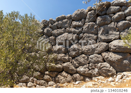 Roman Delikkemer aqueduct bridge on a sunny. Kas, Turkey 134010246