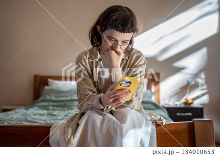 Outcast teenage girl having social difficulties in communication spending time at home in solitude 134010653