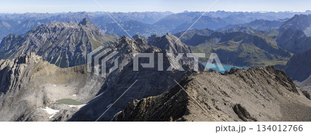 View from Schesaplana during hike in Ratikon mountain range in Vorarlberg, Austria with clear skies and distant peaks 134012766