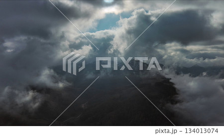 Aerial high view of dramatic clouds and sun Aerial high view of dramatic clouds and sun 134013074