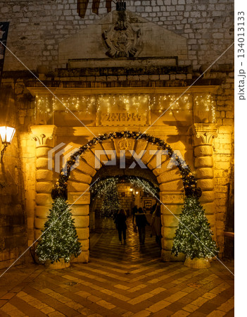 Old town Kotor archway decorated with Christmas trees Old town Kotor archway decorated with Christmas trees 134013133