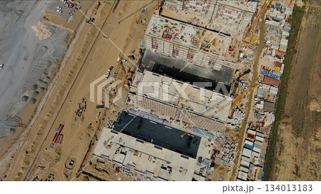 Industrial construction site with houses equipment and materials Industrial construction site with houses equipment and materials 134013183