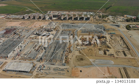 Industrial construction site with construction equipment and materials 134013188