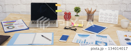 Banner Meeting room Office laptop business financial chart graph coffee cup in conference room. Panorama Flatlay office supply laptop desk. Business graph chart on meeting table with copy space 134014017