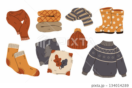 Set of cozy autumnal sweaters, scarves, socks, and warm accessories. Fall apparel clothes, cardigan, beanie kit. Vector hand drawn flat cartoon collection illustration 134014289