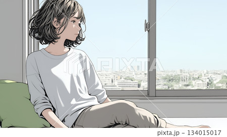 白い壁に向かって考え事をする若い女性