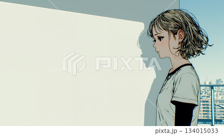 白い壁に向かって考え事をする若い女性