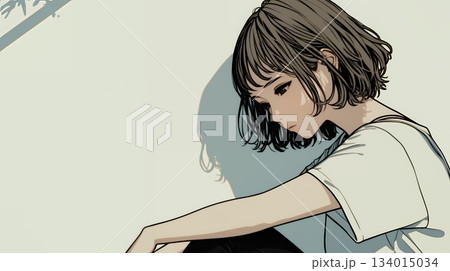 白い壁に向かって考え事をする若い女性