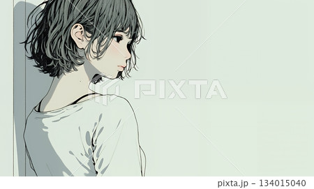 白い壁に向かって考え事をする若い女性