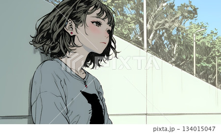 白い壁に向かって考え事をする若い女性