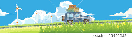 Landscape of touring car with luggage on roof rack with driver. Car drives up a hill surrounded by green grass and flowers in front. Windmill in the background suggesting a windy. Under blue sky. Landscape of touring car with luggage on roof rack with driver. Car drives up a hill surrounded by green grass and flowers in front. Windmill in the background suggesting a windy. Under blue sky. 134015824