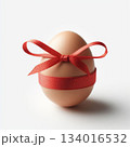 Brown Chicken Egg Wrapped with Red Gift Ribbon on Clean White Background 134016532